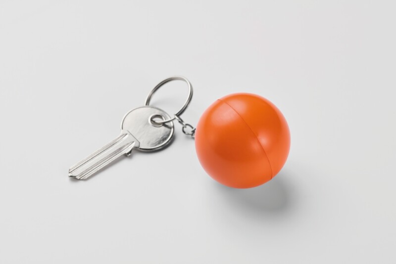 Klíčenka z PU ve tvaru koule, oranžová