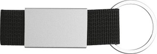 Přívěšek na klíče kombinující barevný textil a nerezový plíšek, černý